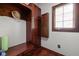 A mud room with hardwood floors, lots of storage and a window at 7126 Nile Ridge Ct, Indianapolis, IN 46236