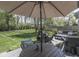 This beautifully landscaped backyard includes a large deck with multiple seating options and a lush lawn at 7203 Sycamore Run Dr, Indianapolis, IN 46237
