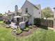 Enjoy outdoor dining on the deck of this home with a fully fenced backyard and beautiful landscaping at 7203 Sycamore Run Dr, Indianapolis, IN 46237