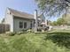 This fenced backyard features a deck for entertaining and mature landscaping that provides additional privacy at 7203 Sycamore Run Dr, Indianapolis, IN 46237