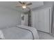 Bedroom featuring large closet and a bed with a cozy comforter; calm, inviting space at 7203 Sycamore Run Dr, Indianapolis, IN 46237