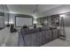 Enjoy movie nights in this finished basement theater room with projector, screen, speakers and comfortable sectional sofa at 7203 Sycamore Run Dr, Indianapolis, IN 46237