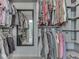 Organized walk-in closet with ample hanging space and built-in shelving at 7203 Sycamore Run Dr, Indianapolis, IN 46237