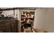 Unfinished basement with storage, and a laundry washing machine and dryer combo visible at 725 E New York E St, Indianapolis, IN 46202