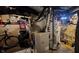 Utility area of the unfinished basement featuring a furnace and water heater at 725 E New York E St, Indianapolis, IN 46202