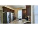 Modern kitchen featuring stainless steel appliances and dark wood cabinets at 725 E New York E St, Indianapolis, IN 46202