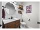Charming powder room features a rustic wood vanity, decorative accents, and shiplap walls at 7319 Hartington Pl, Indianapolis, IN 46259