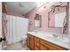 Traditional bathroom featuring a double vanity and shower/tub at 7319 Hartington Pl, Indianapolis, IN 46259