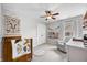 Cozy bedroom with a crib, soft lighting, and a comfortable rocking chair at 7319 Hartington Pl, Indianapolis, IN 46259