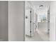 Bright hallway with neutral walls, carpet, and white doors at 7319 Hartington Pl, Indianapolis, IN 46259