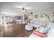 Spacious open-concept living area with seamless transition into dining and kitchen areas with modern fixtures at 7319 Hartington Pl, Indianapolis, IN 46259