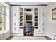 Bright office featuring built-in cabinets, desk space, and neutral paint at 7319 Hartington Pl, Indianapolis, IN 46259