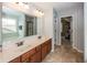 Double sink bathroom vanity with large mirror; a bright and functional space at 755 Canberra Blvd, Westfield, IN 46074
