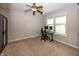 Bright bedroom features carpet flooring, ceiling fan, a closet, and natural light from a large window at 755 Canberra Blvd, Westfield, IN 46074