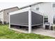 The home features a covered patio with optional full privacy screen at 755 Canberra Blvd, Westfield, IN 46074