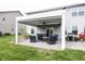 The home features a covered patio with a fan and recessed lights for evening relaxing at 755 Canberra Blvd, Westfield, IN 46074