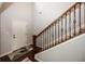 Foyer showcasing a staircase with wood and metal railings and a stylish rug at 755 Canberra Blvd, Westfield, IN 46074