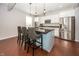 Stylish kitchen features an island with seating, stainless steel appliances, and white cabinetry at 755 Canberra Blvd, Westfield, IN 46074