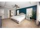 Comfortable main bedroom with a tray ceiling, large windows, and an ensuite bathroom at 755 Canberra Blvd, Westfield, IN 46074