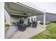 Covered patio with comfortable seating area, ideal for outdoor relaxation and entertaining at 755 Canberra Blvd, Westfield, IN 46074