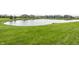 Beautiful backyard pond and community views from the lush green lawn at 755 Canberra Blvd, Westfield, IN 46074