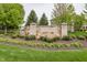 Attractive stone KEENELAND PARK sign surrounded by landscaped garden bed with fresh green plants at 755 Canberra Blvd, Westfield, IN 46074