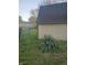 View of fenced backyard showing storage shed and landscaping at 7622 Eaker Ct, Brownsburg, IN 46112