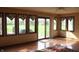 Sunroom with a sliding glass door and large windows overlooking the backyard at 7622 Eaker Ct, Brownsburg, IN 46112