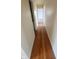 Bright hallway with hardwood floors creates a warm and inviting transition to the next room at 7629 Walton Dr, Indianapolis, IN 46214