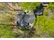 Aerial view of home, showcasing deck, surrounding trees, and an umbrella-covered table at 8277 N Lasalle Rd, Morgantown, IN 46160