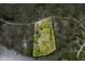 Aerial view showing property lines surrounding wooded lot with cozy house on lush land with green and brown trees at 8277 N Lasalle Rd, Morgantown, IN 46160