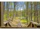 Scenic backyard with a long staircase through a beautiful forest leading down to a dock and the water at 8277 N Lasalle Rd, Morgantown, IN 46160