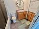 Bathroom with vanity, washer/dryer and shower/tub combination at 8277 N Lasalle Rd, Morgantown, IN 46160