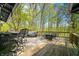 Spacious deck featuring stylish outdoor furniture, perfect for relaxation and entertaining amidst the serene wooded views at 8277 N Lasalle Rd, Morgantown, IN 46160