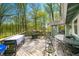 Large deck with multiple seating areas and outdoor cooking setup, overlooking lush greenery and providing ample space at 8277 N Lasalle Rd, Morgantown, IN 46160
