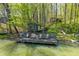 Inviting waterfront cabin features a spacious wooden dock with seating, perfect for enjoying serene lake views and outdoor relaxation at 8277 N Lasalle Rd, Morgantown, IN 46160