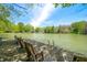 Lake view with dock and set of chairs on a sunny day at 8277 N Lasalle Rd, Morgantown, IN 46160