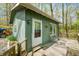 Charming cottage featuring a wooden deck, surrounded by mature trees for added privacy at 8277 N Lasalle Rd, Morgantown, IN 46160