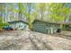 Property featuring detached garages with gravel driveway at 8277 N Lasalle Rd, Morgantown, IN 46160