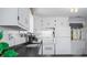 Bright kitchen features stainless appliances, white cabinetry, and great lighting that makes it easy to prepare your favorite meals at 8277 N Lasalle Rd, Morgantown, IN 46160