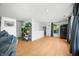 Bright living area featuring hardwood floors, plants and comfortable seating at 8277 N Lasalle Rd, Morgantown, IN 46160