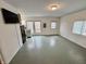 Open-concept living room, kitchen and dining area with modern appliances, tile floors and neutral paint at 8277 N Lasalle Rd, Morgantown, IN 46160