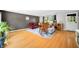 Comfortable living room featuring a red leather recliner, rocking chair, hardwood floors, and serene views at 8277 N Lasalle Rd, Morgantown, IN 46160
