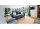 Comfortable living room with large windows, hardwood floors, couch and neutral decor create a cozy, inviting space at 8277 N Lasalle Rd, Morgantown, IN 46160