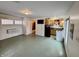 Open-concept living room, kitchen and dining area with modern appliances, tile floors and neutral paint at 8277 N Lasalle Rd, Morgantown, IN 46160