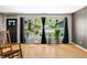 Bright living room featuring hardwood floors, a large picture window, and neutral decor that brings the outside in at 8277 N Lasalle Rd, Morgantown, IN 46160