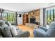 Living room featuring a stone fireplace, hardwood floors, neutral paint and comfortable seating that is perfect for relaxing at 8277 N Lasalle Rd, Morgantown, IN 46160