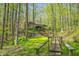 Exterior shot of property with wooded views and path at 8277 N Lasalle Rd, Morgantown, IN 46160