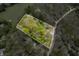 Aerial view with property lines, highlighting a home nestled amidst a forest at 8277 N Lasalle Rd, Morgantown, IN 46160