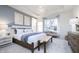 Main bedroom with tray ceiling, large window and sitting area at 8436 Paxton Dr, Brownsburg, IN 46112